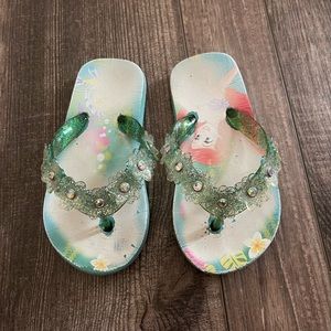 Blue Ariel flip flops